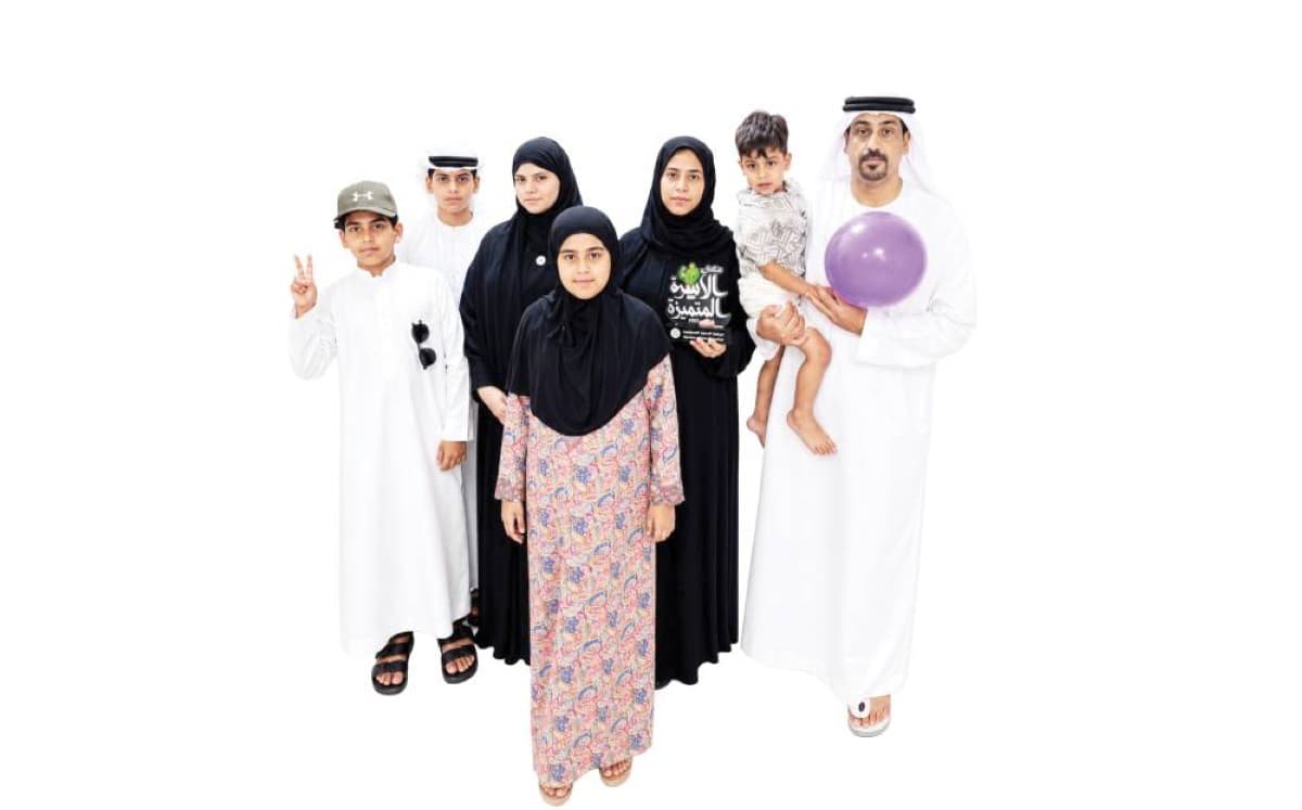 Members of the Al Hantoobi family posing together as part of their volunteer activities with the Shukran Li Ataaik volunteer team in the UAE.
