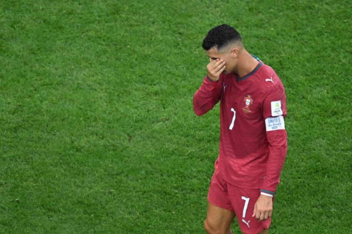 Cristiano Ronaldo in tears on the pitch following Portugal's elimination from the 2026 World Cup after a 1–0 defeat to Spain.