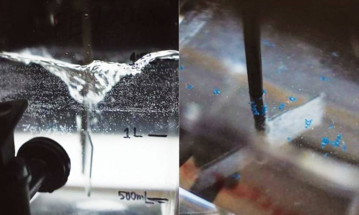 A close-up illustration of microplastic particles being captured from wastewater using air bubble technology.