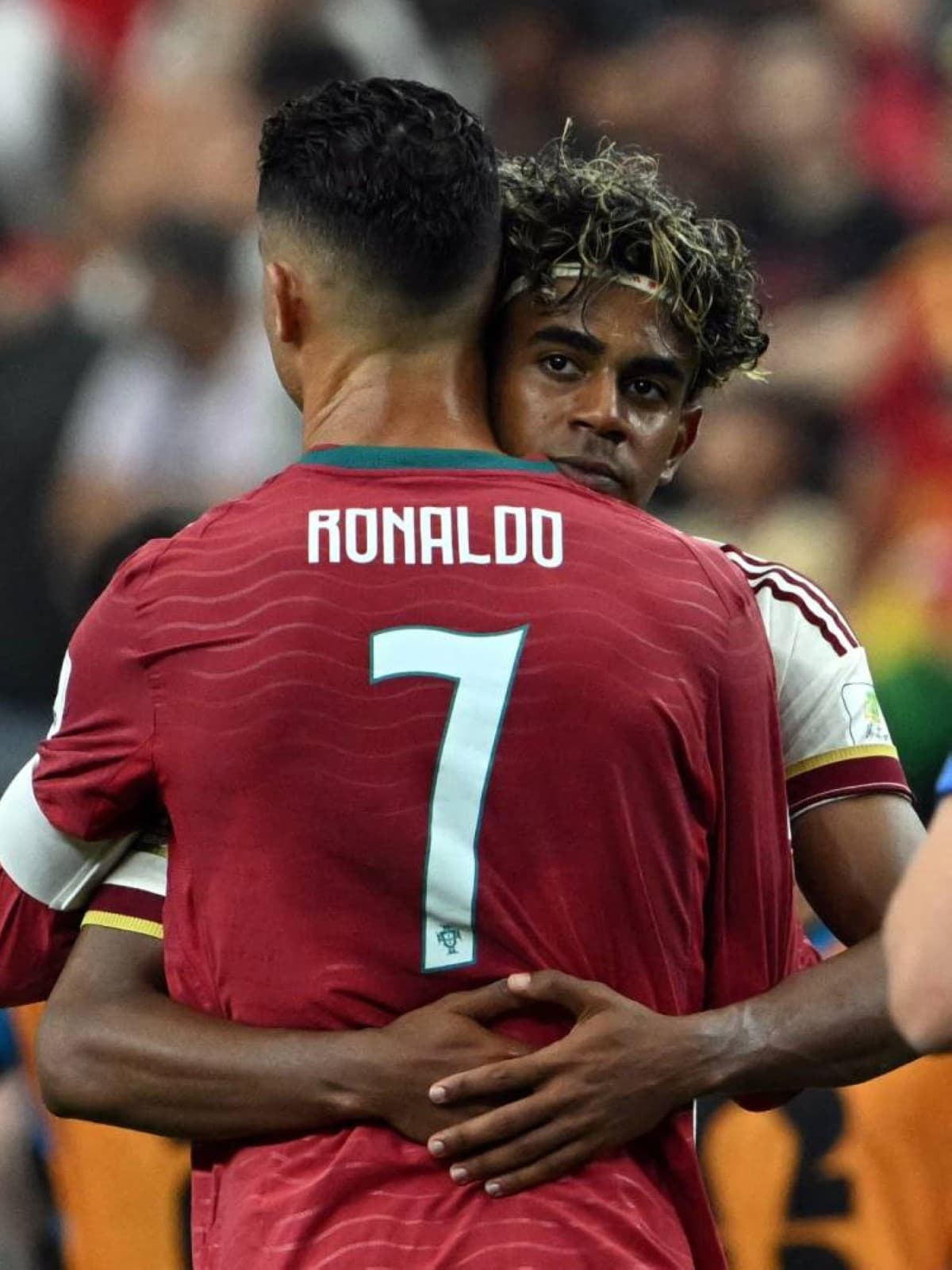 Lamine Yamal embraces a visibly emotional Cristiano Ronaldo on the pitch following Spain's 1-0 victory over Portugal in the 2026 World Cup round of 16.