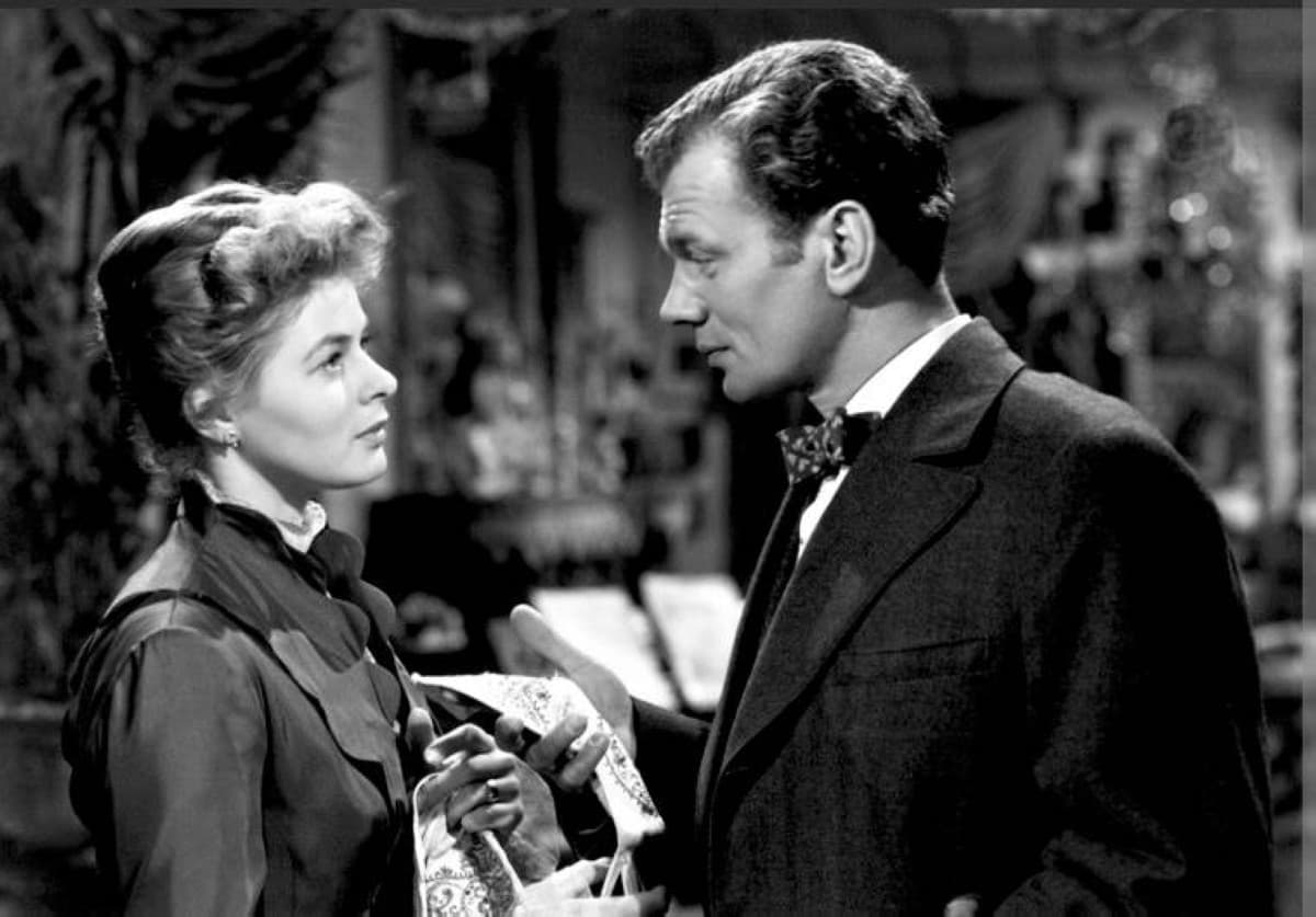 A cinematic still evoking the shadowy, gas-lit Victorian interior of the 1944 psychological thriller Gaslight, with high-contrast lighting casting deep shadows across a domestic setting.