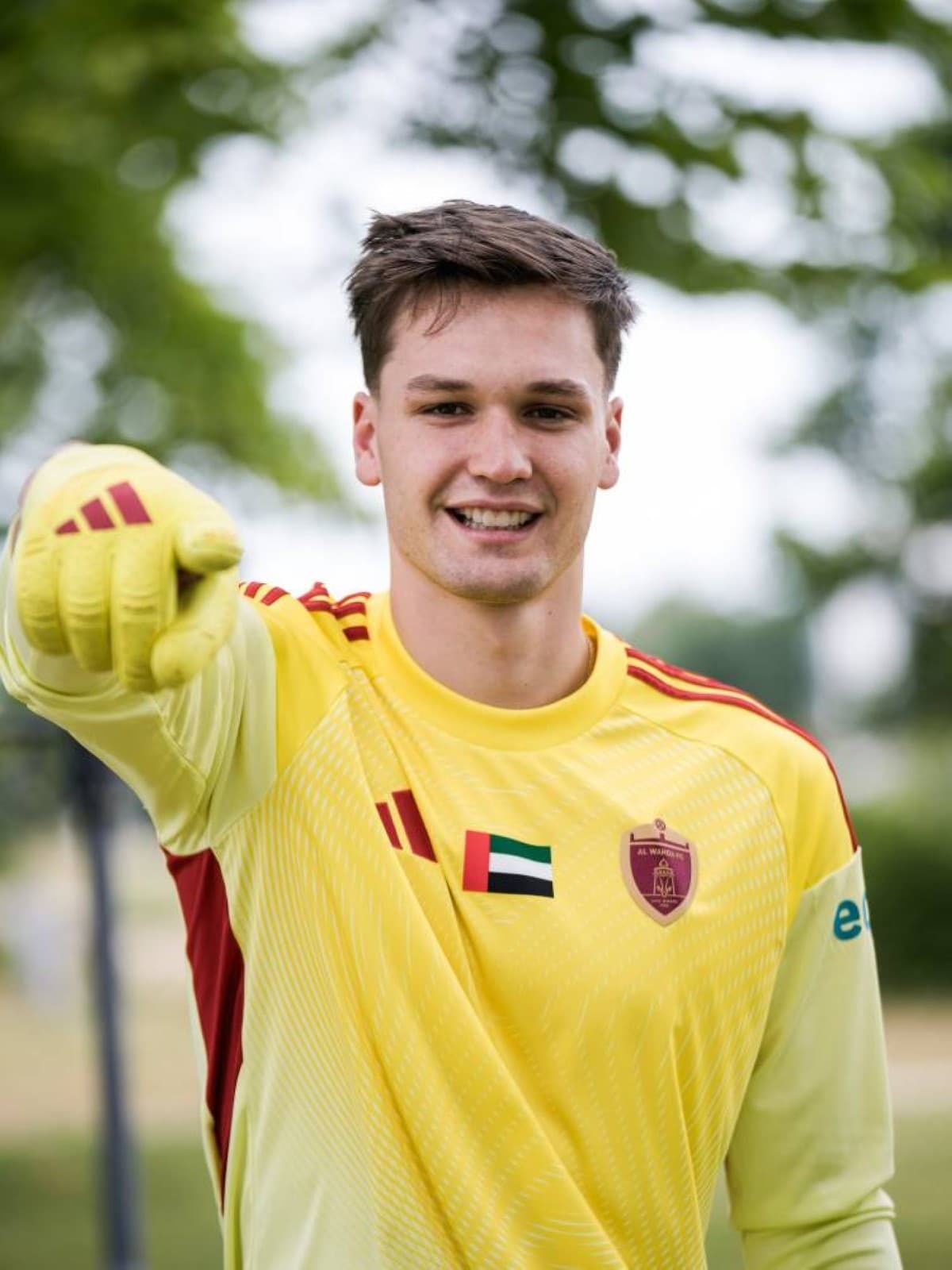 Al Wahda's new Paraguayan goalkeeper Facundo Enсefran poses in the club's kit after signing from Club Olimpia.