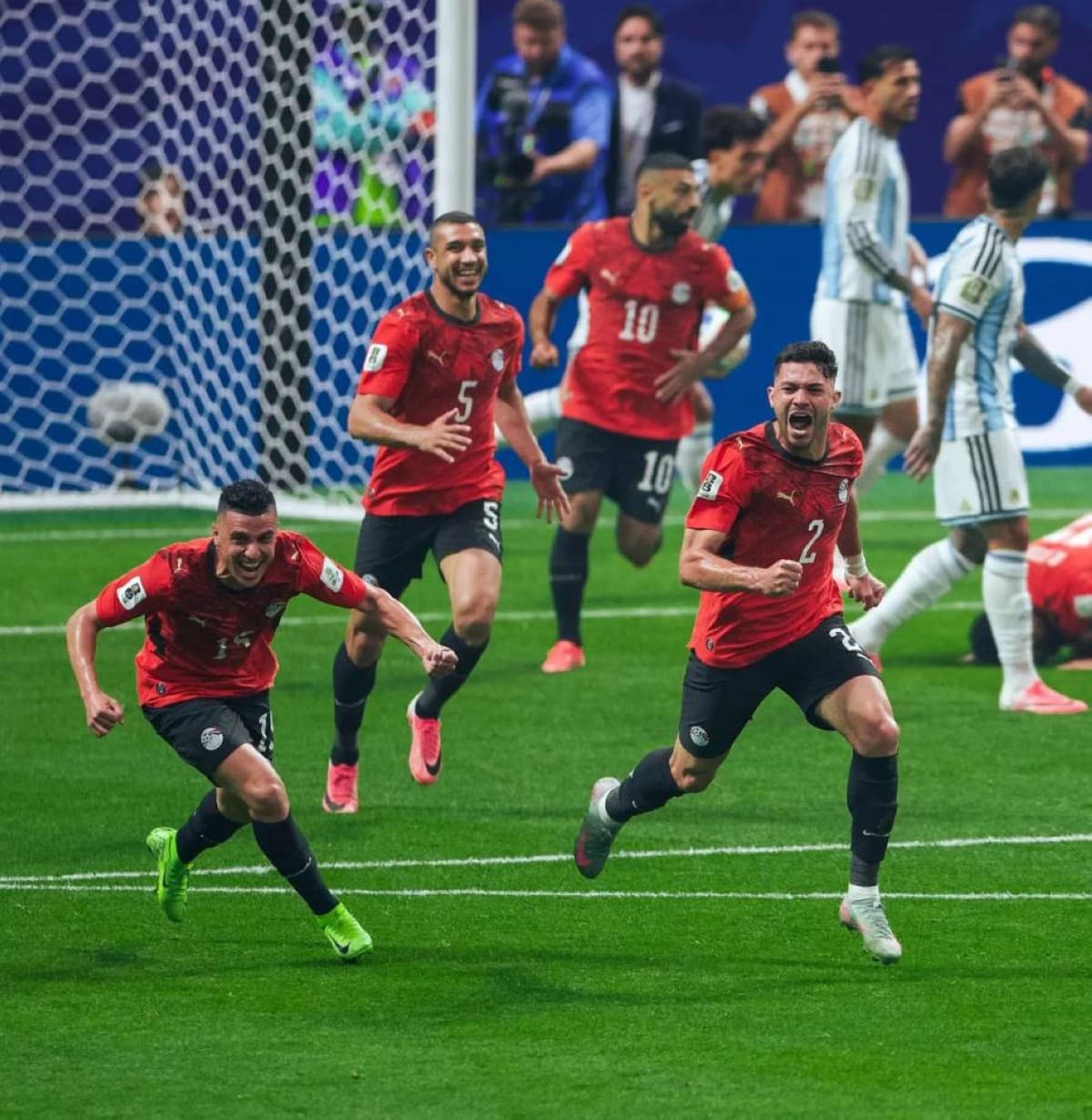 Egypt national football team players on the pitch during their 2026 FIFA World Cup round of 16 match against Argentina.
