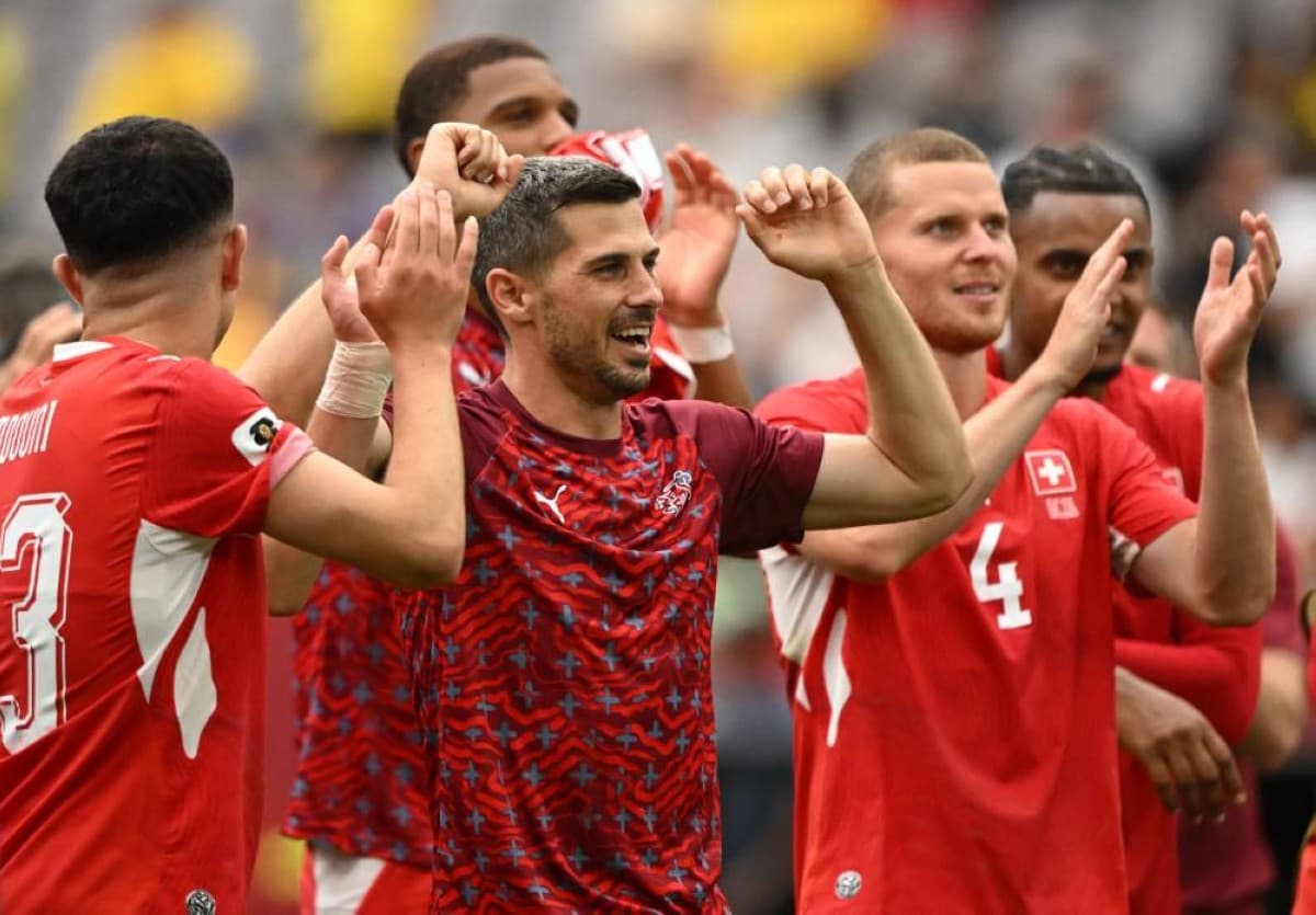 Swiss players celebrate after defeating Colombia in a penalty shootout to reach the 2026 FIFA World Cup quarter-finals at BC Place stadium in Vancouver, Canada.