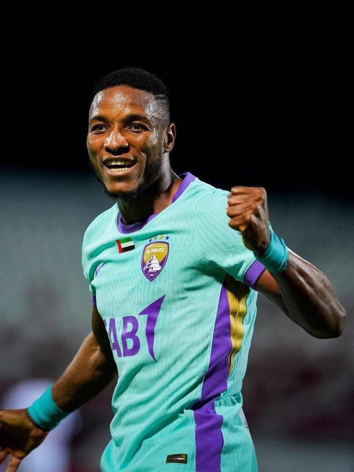 Togolese striker Laba Kodjo in Al Ain's purple jersey celebrating one of his record-breaking goals during his seven-season stint with the club.