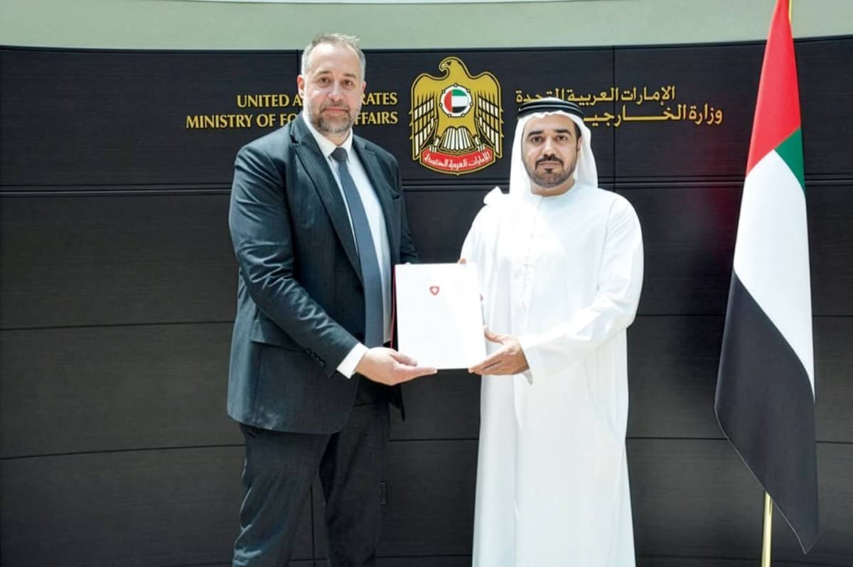 Rashid Abdullah Al Qusair receiving the consular exequatur from Swiss Consul General Christoph Friedrich Bueler at the Ministry of Foreign Affairs office in Dubai.