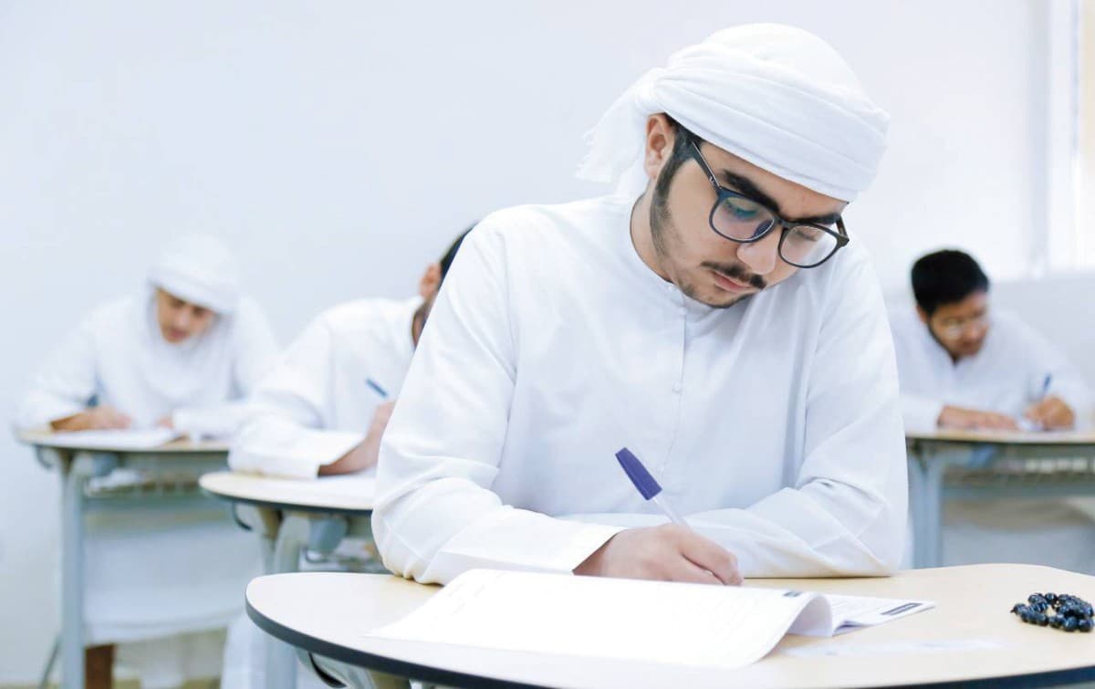 Students or parents reviewing academic results on a digital device, illustrating the Ministry of Education's electronic certificate and results announcement system.