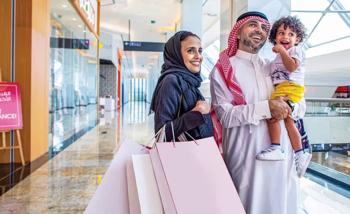 Shoppers and visitors at a Dubai shopping centre during the Dubai Summer Surprises season, enjoying promotional offers and entertainment events.
