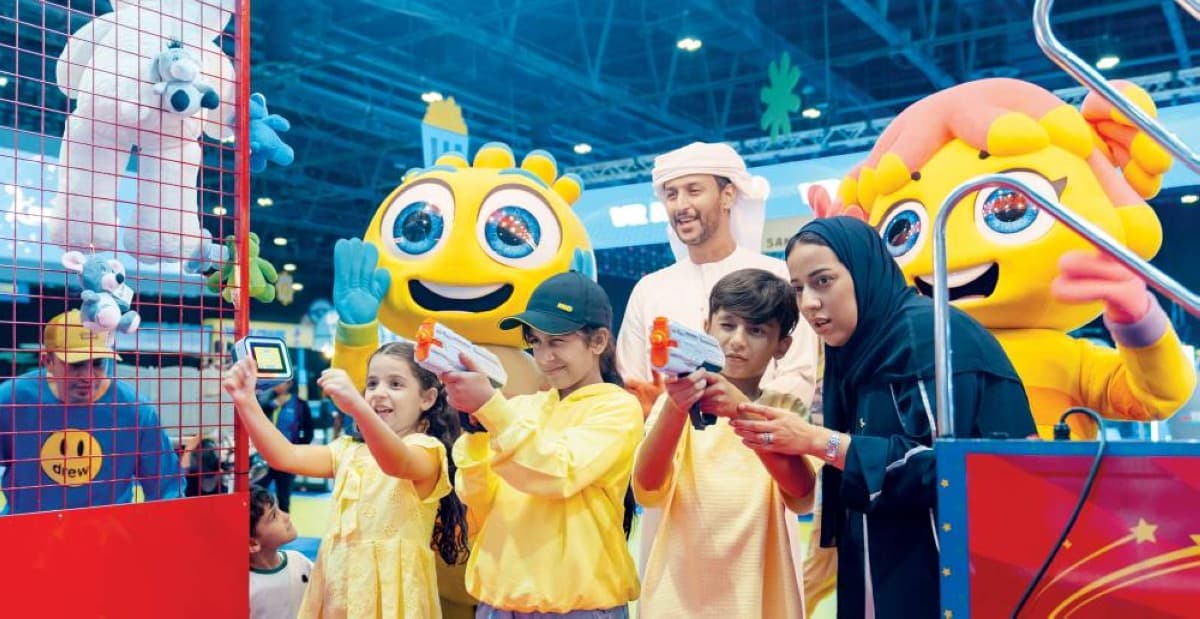 Visitors and families enjoying entertainment activities and games at the Wonderful World indoor entertainment destination at the Dubai World Trade Centre.