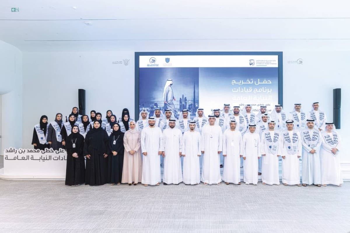 Officials and graduates pose at the Dubai Public Prosecution headquarters during the graduation ceremony of the AI and behavioural sciences leadership programme.