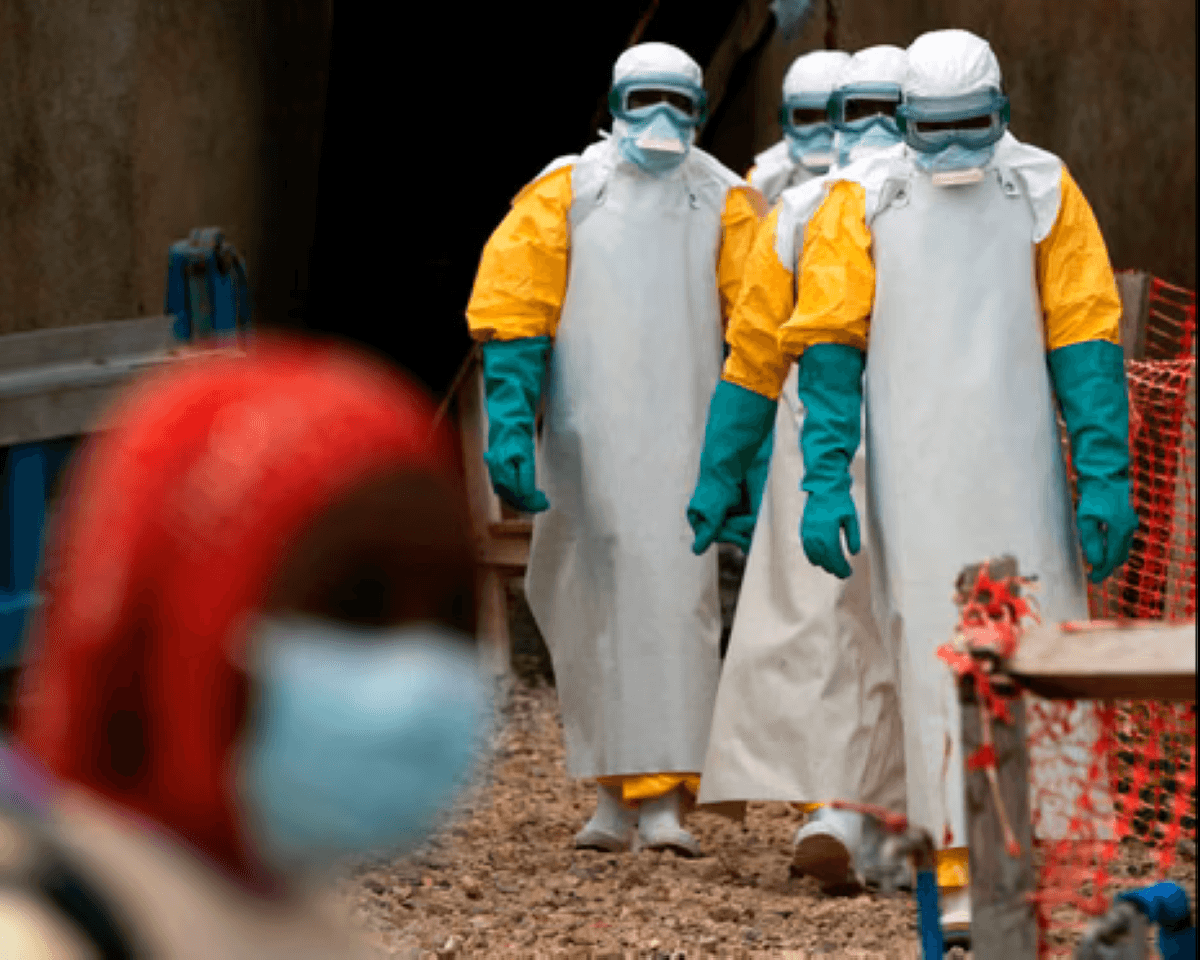A health worker in protective equipment attends to Ebola patients at a treatment centre in the Democratic Republic of Congo.
