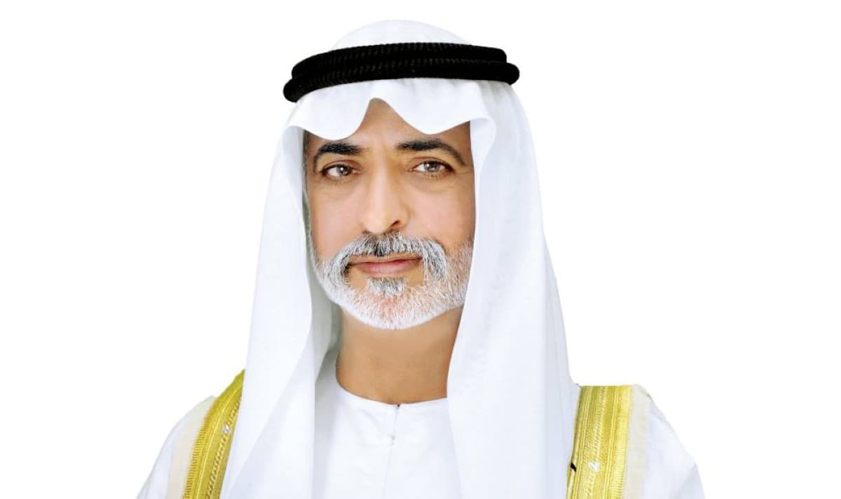 Sheikh Nahyan bin Mubarak Al Nahyan reviews activities at a Sandooq Al Watan summer programme venue attended by students and trainers.