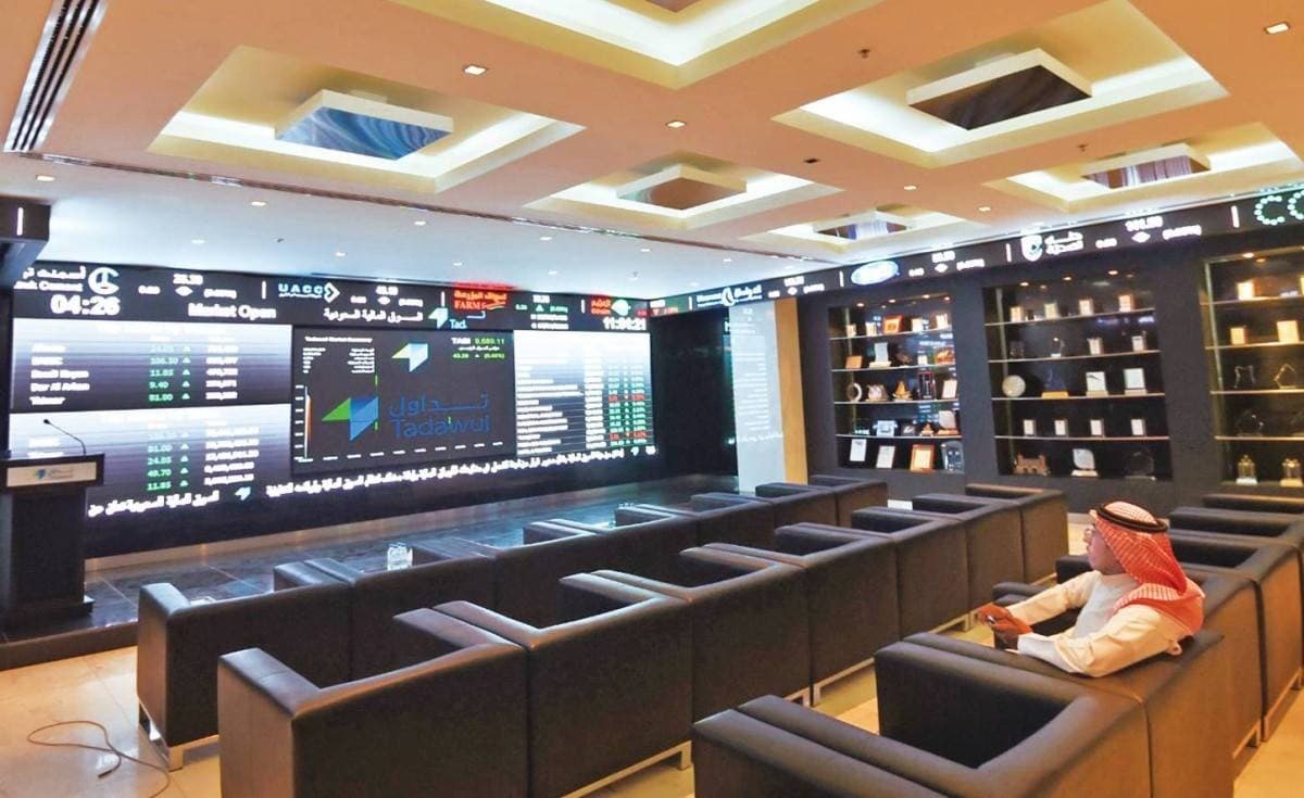 An electronic display board shows stock market indices and share price movements at an Arab stock exchange.
