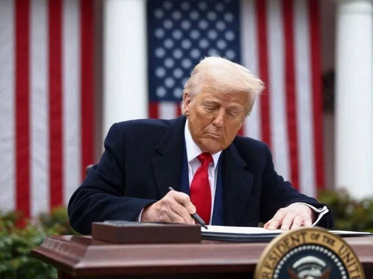US President Donald Trump at a formal event, depicted ahead of moves to dismiss federal election officials before the November midterm elections.
