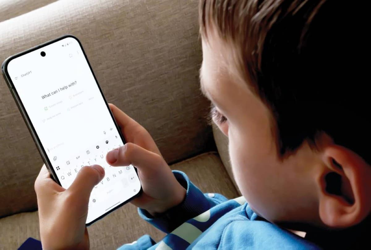 A young child using a tablet device to access an AI chatbot application.