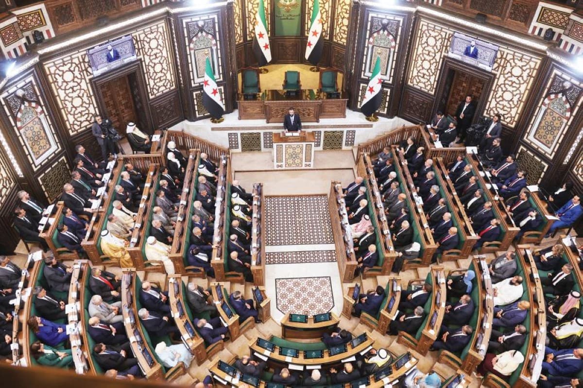 Members of Syria's transitional People's Assembly gathered at the inaugural session, with President Ahmad al-Sharaa presiding over the historic proceedings.