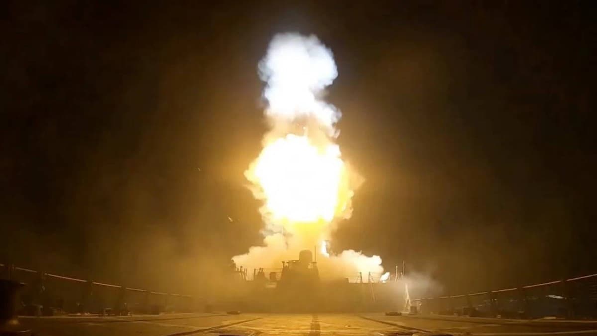 Smoke rises over a coastal Iranian city as US military strikes target sites near the Strait of Hormuz.