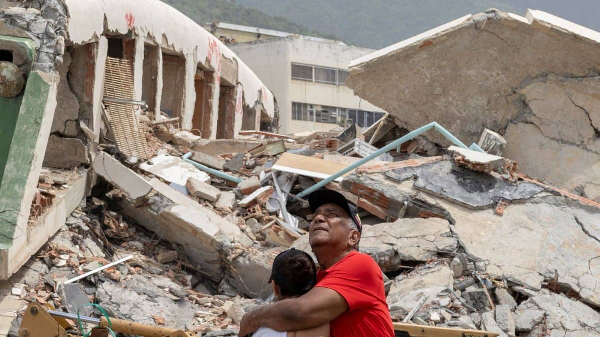 Rescue workers at the scene of earthquake damage in Venezuela's Yaracuy state following the two powerful tremors.