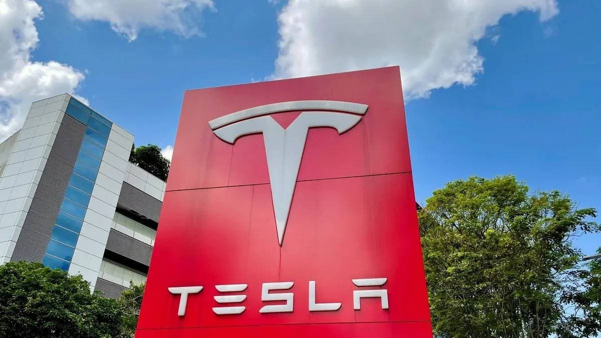 A Tesla electric vehicle on display, illustrating the company's stock decline amid valuation concerns and production line changes.
