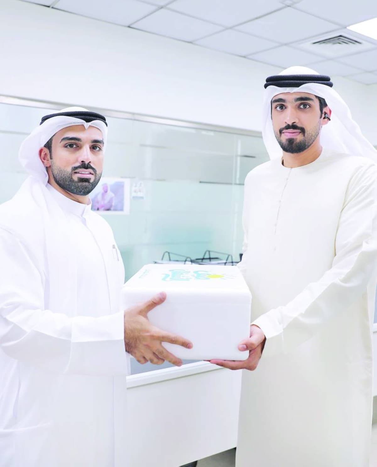 Sharjah Department of Public Works staff receiving summer refreshments during the 'Summer of Public Works' initiative.