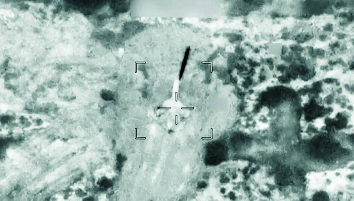 Warships and commercial tankers navigating the Strait of Hormuz amid heightened military tensions between Iran and the United States.