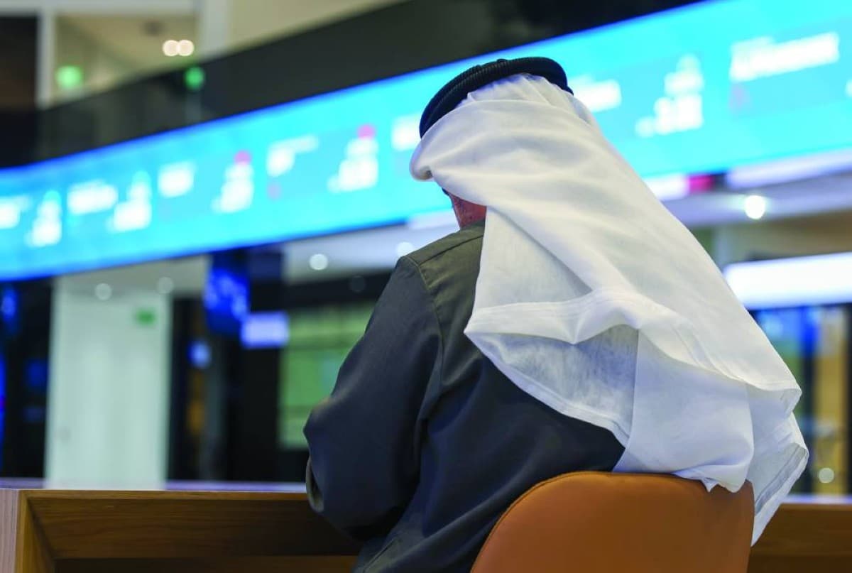 An electronic trading board displaying Arab stock market indices amid declining performance driven by geopolitical tensions in the Middle East.