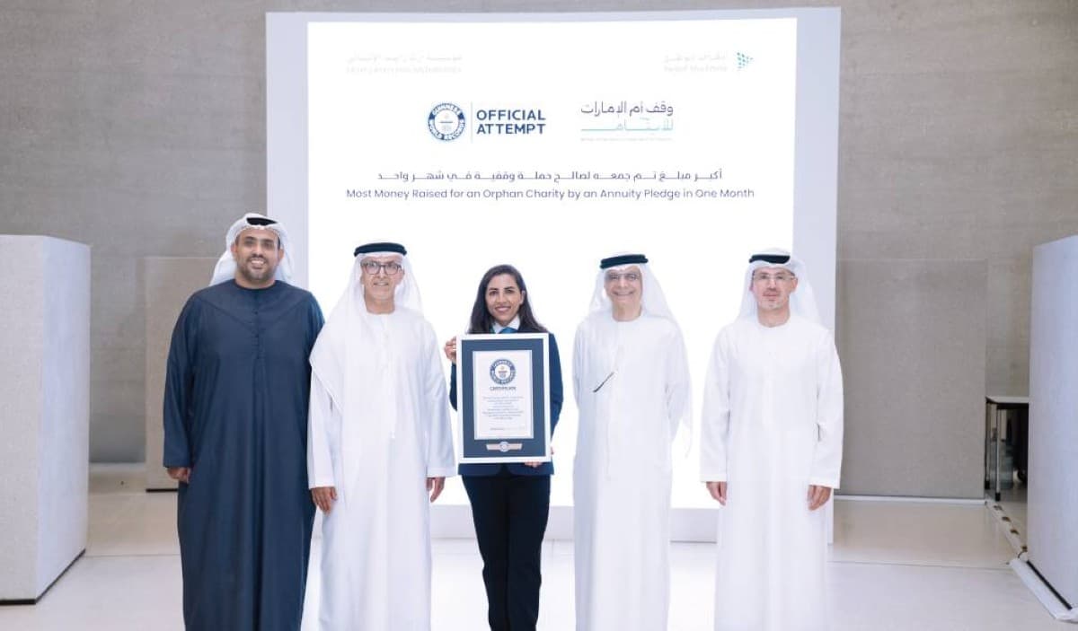 Officials from Awqaf Abu Dhabi celebrate the Guinness World Record achievement for the Umm Al Emarat Waqf for Orphans campaign at a ceremony attended by senior officials and partners.