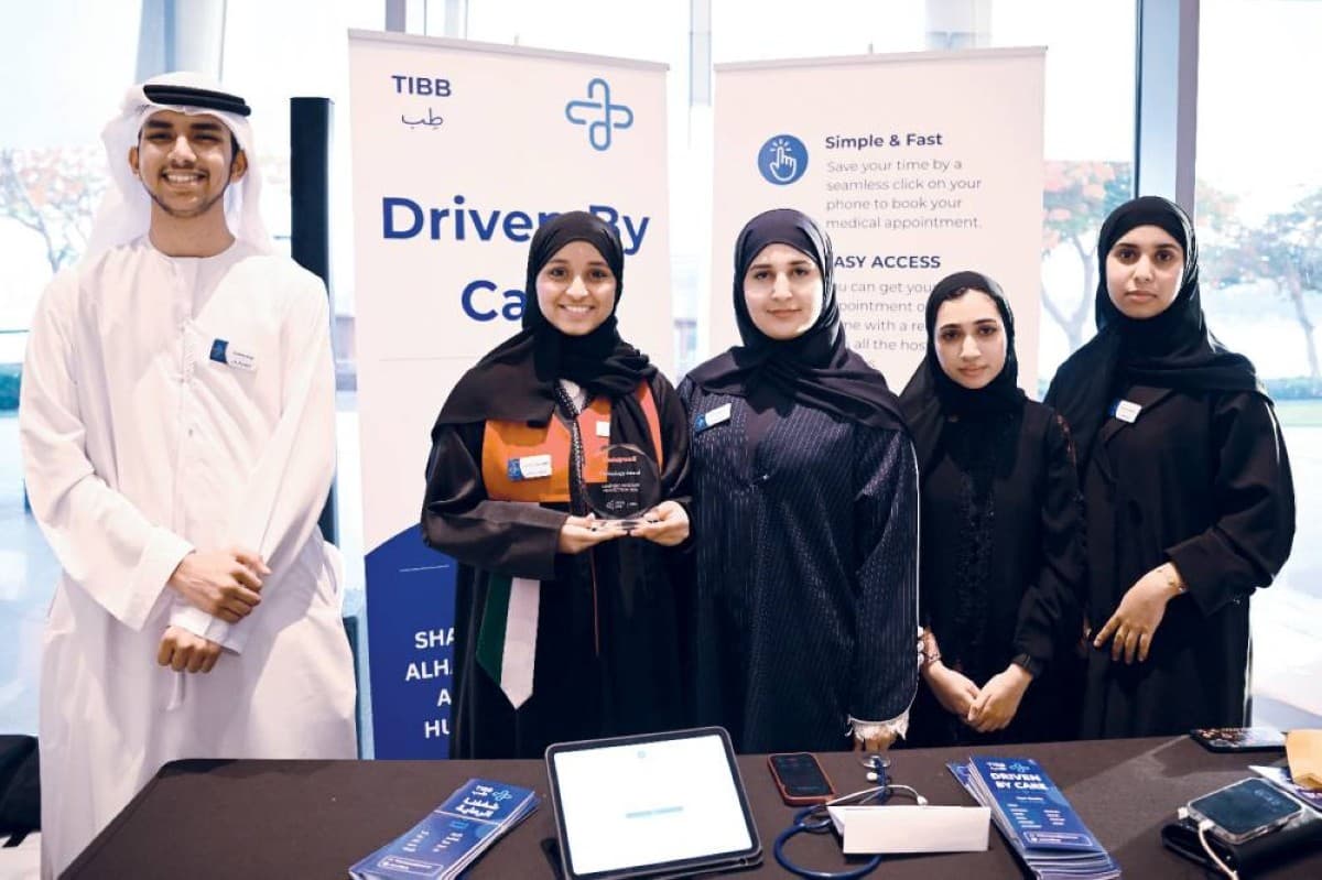 Students from Al Zawraa Secondary School presenting their award-winning smart health app 'Teb' at the Injaz competition.