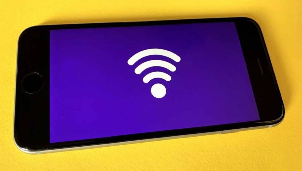 A Wi-Fi router placed in a home setting, illustrating the question of sharing internet access with neighbours.