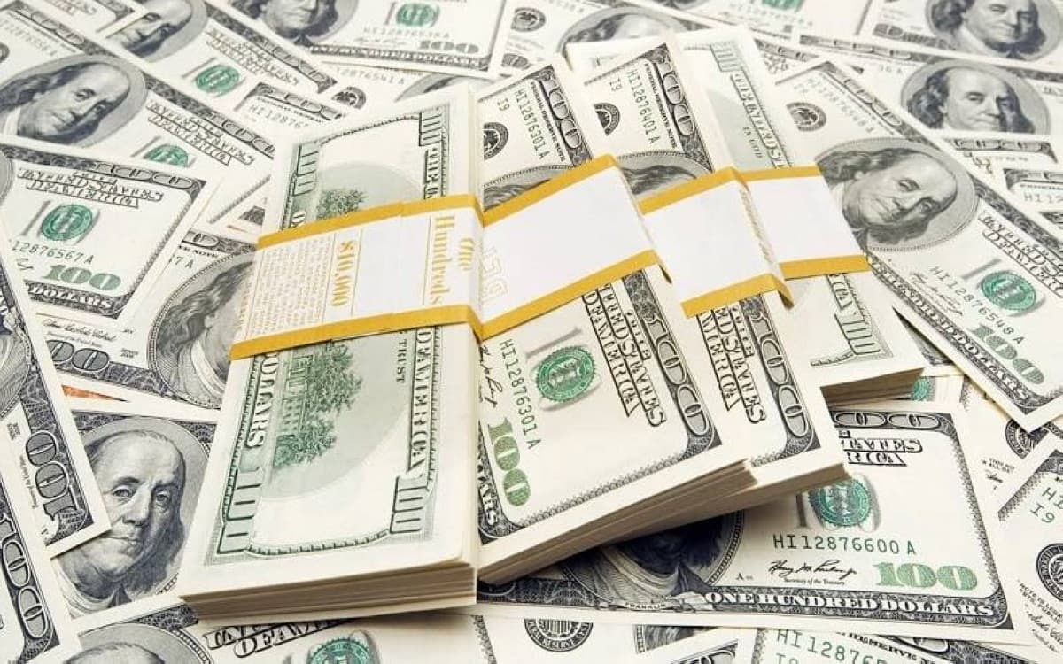 Currency exchange rate boards displaying dollar, euro, and yen figures as the US dollar steadies following weaker-than-expected inflation data.