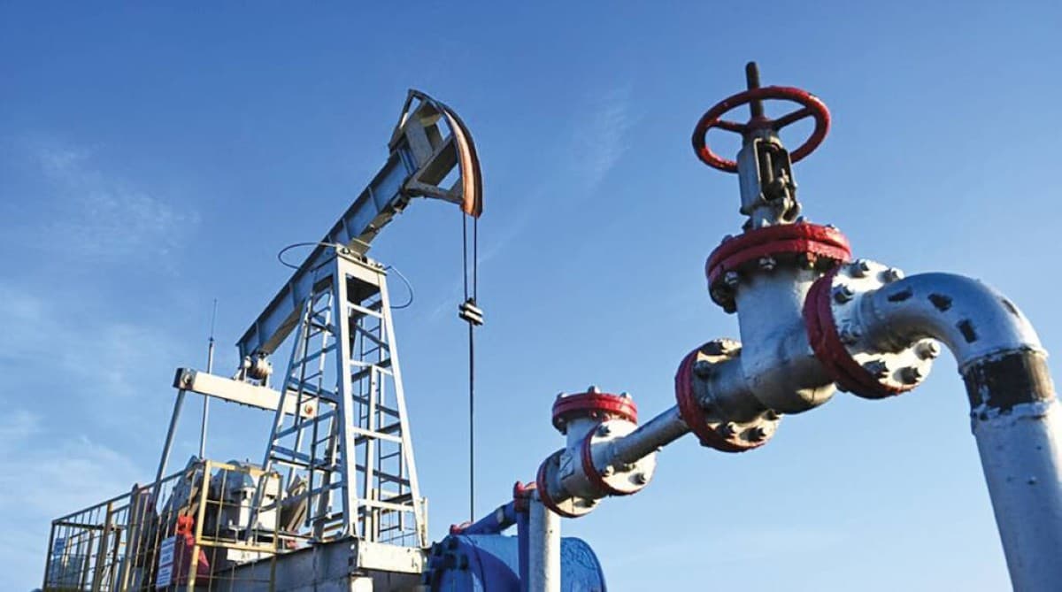 Oil storage tanks and refinery infrastructure reflecting supply concerns amid Strait of Hormuz disruptions.