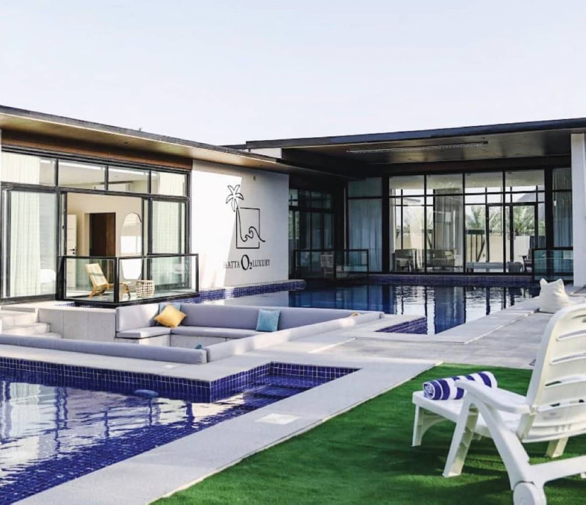 Families enjoying an outdoor gathering at a farm or retreat in the UAE, surrounded by green landscapes and natural open spaces.