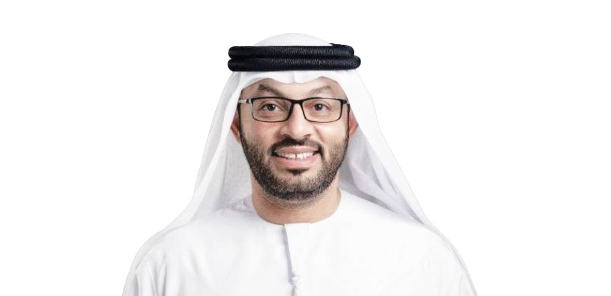 A representative from the Islamic Affairs and Charitable Activities Department in Dubai at an event showcasing the 'Thamarat Sadaqatikum' charitable initiative.
