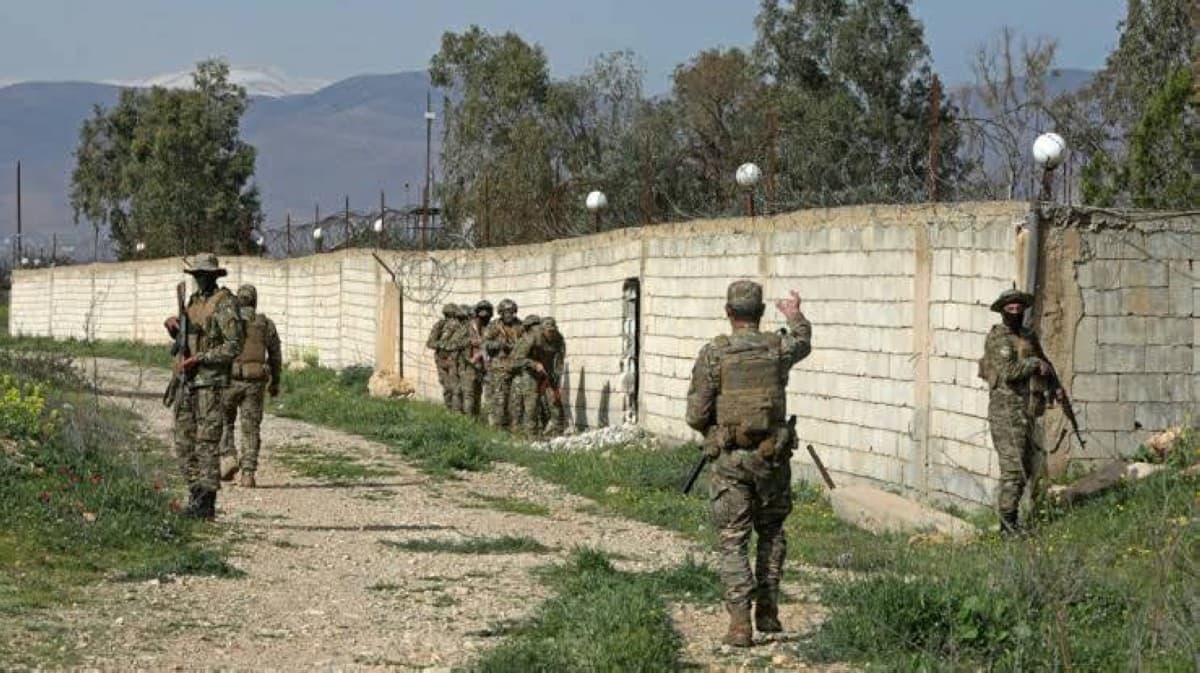 Syrian border security forces inspect a seized oil tanker at the Al-Tanf crossing with Iraq, where a large weapons cache including long-range missiles and drones was discovered.