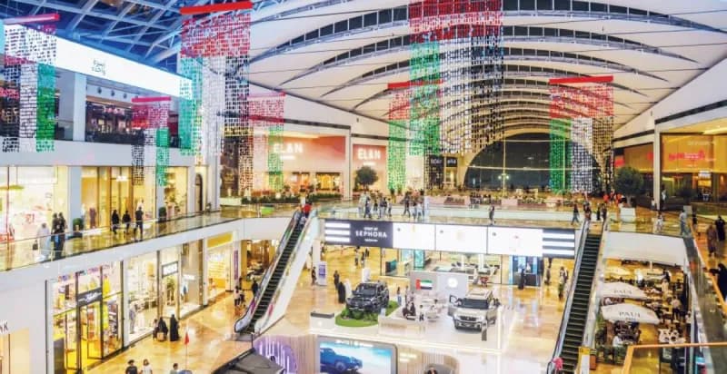 Shoppers and families browsing a busy Dubai shopping mall during the Eid holiday period.
