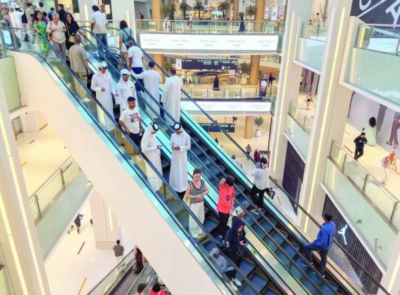 Shoppers browsing discounted products at a Dubai retail destination during the '3 Days of Super Sales' event.