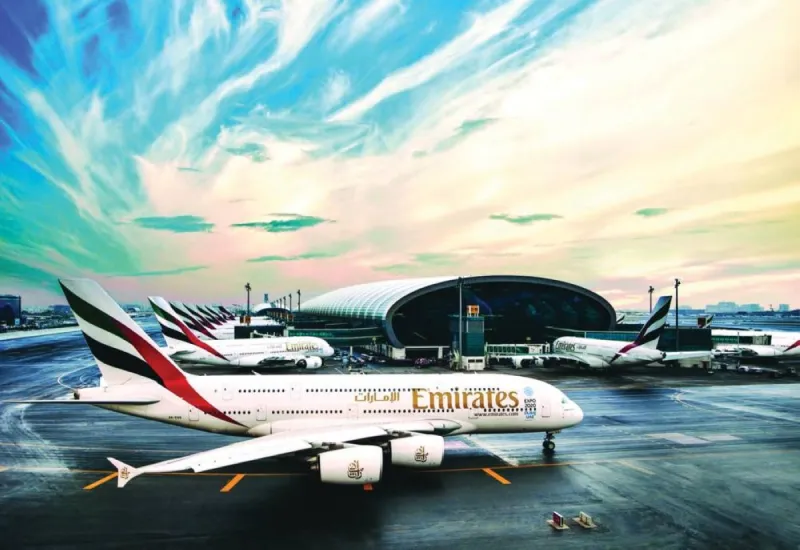 A wide-angle view of a UAE international airport terminal with aircraft on the tarmac, illustrating the country's status as a leading global aviation hub.