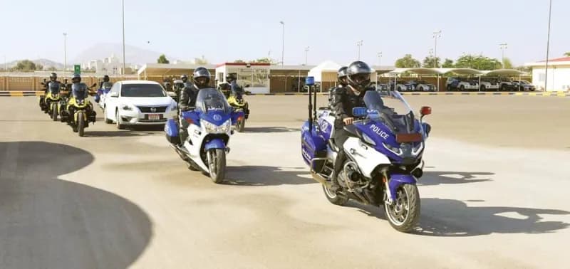 Abu Dhabi Police officers pose with graduates of the foundational motorcycle training course at the Criminal Justice Institute in Al Ain.