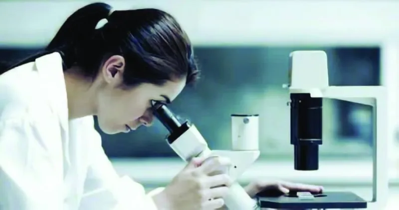 A close-up of a DNA strand being analysed in a medical laboratory setting.