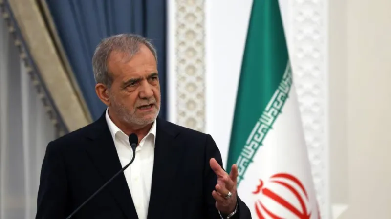 Iranian President Masoud Pezeshkian speaking at an official government setting.