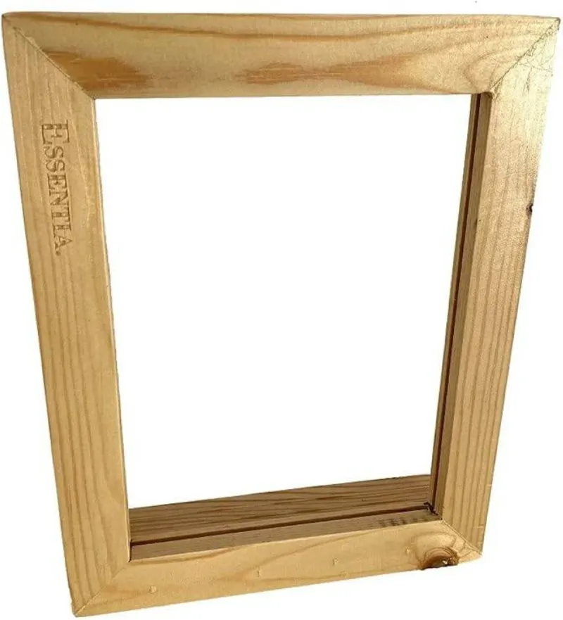 A weathered wooden picture frame resting against a worn surface, evoking solitude and the passage of time.