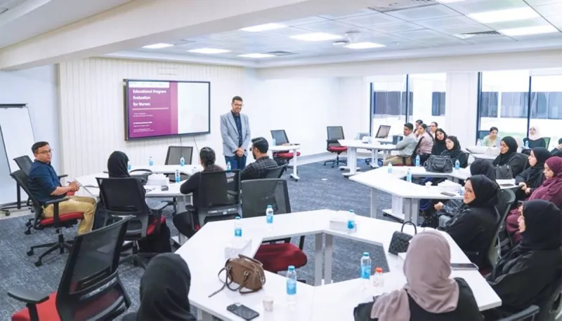 Nursing staff and trainers participate in an interactive workshop on measuring and evaluating training effectiveness at an Emirates Health Services training centre.