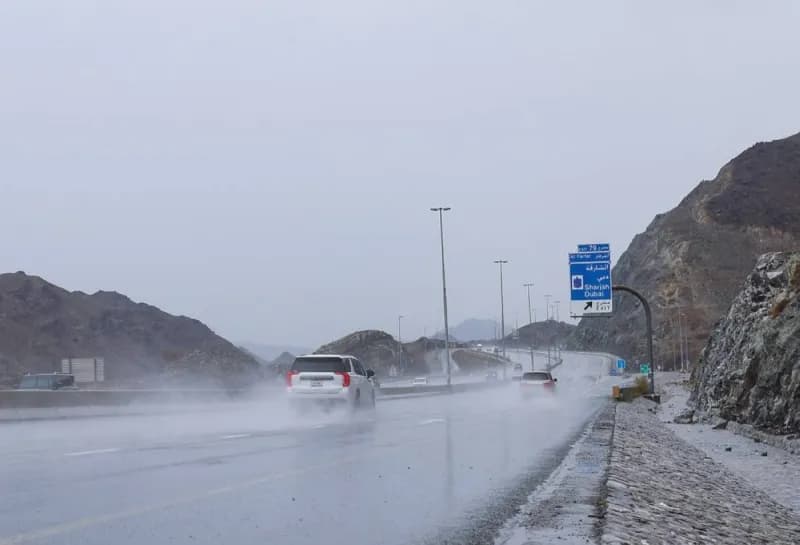 Rain clouds over the mountains surrounding Fujairah and Khor Fakkan during the summer Rawayeh rainfall.