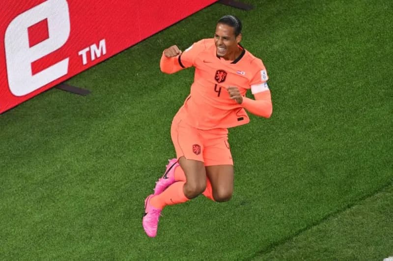 Virgil van Dijk celebrating after scoring a header for the Netherlands against Japan at the 2026 World Cup.
