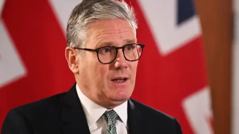 British Prime Minister Keir Starmer speaking at a press conference regarding the US-Iran peace agreement and the Strait of Hormuz.