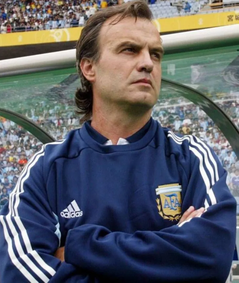 Marcelo Bielsa gestures from the touchline in his Uruguay coaching role during the 2026 World Cup.