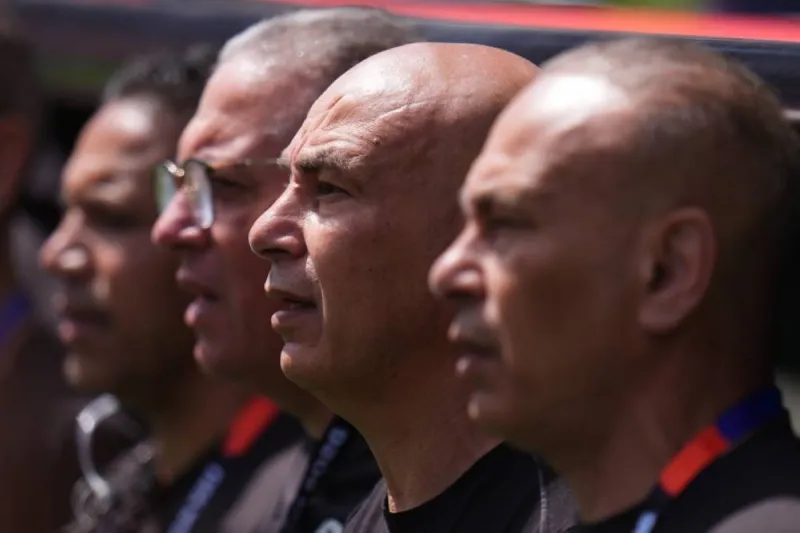 Hossam Hassan and Ibrahim Hassan stand together on the sideline in their roles as Egypt national team head coach and team director at the 2026 World Cup.