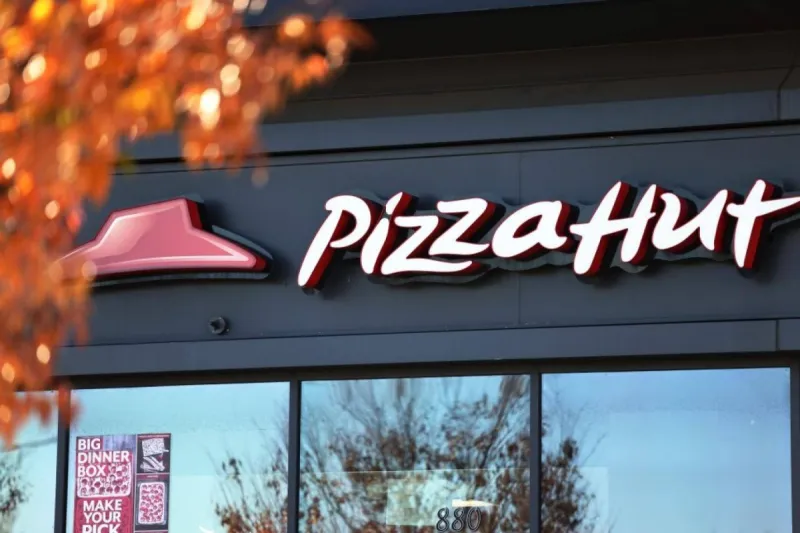 A Pizza Hut restaurant exterior, representing the chain's sale to Long Range Capital in a $2.7 billion deal.
