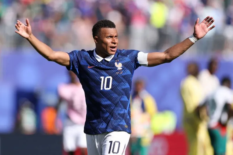 Michael Olise celebrating after being named man of the match in France's 3-1 victory over Senegal at the 2026 World Cup.