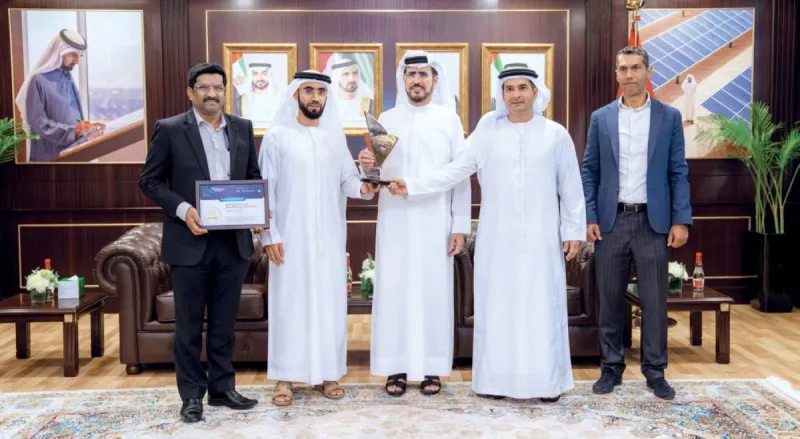DEWA officials holding the Best Innovator of the Year and Best Engineering Product of the Year 2026 awards at the Digital Engineering Awards ceremony.
